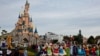 (FILES) Disney cast members take part in a parade during a ceremony marking the 100th anniversary of the Walt Disney Company, held at Disneyland Paris, in Marne-la-Vallee, east of Paris, on October 16, 2023.