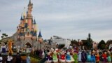 (FILES) Disney cast members take part in a parade during a ceremony marking the 100th anniversary of the Walt Disney Company, held at Disneyland Paris, in Marne-la-Vallee, east of Paris, on October 16, 2023.